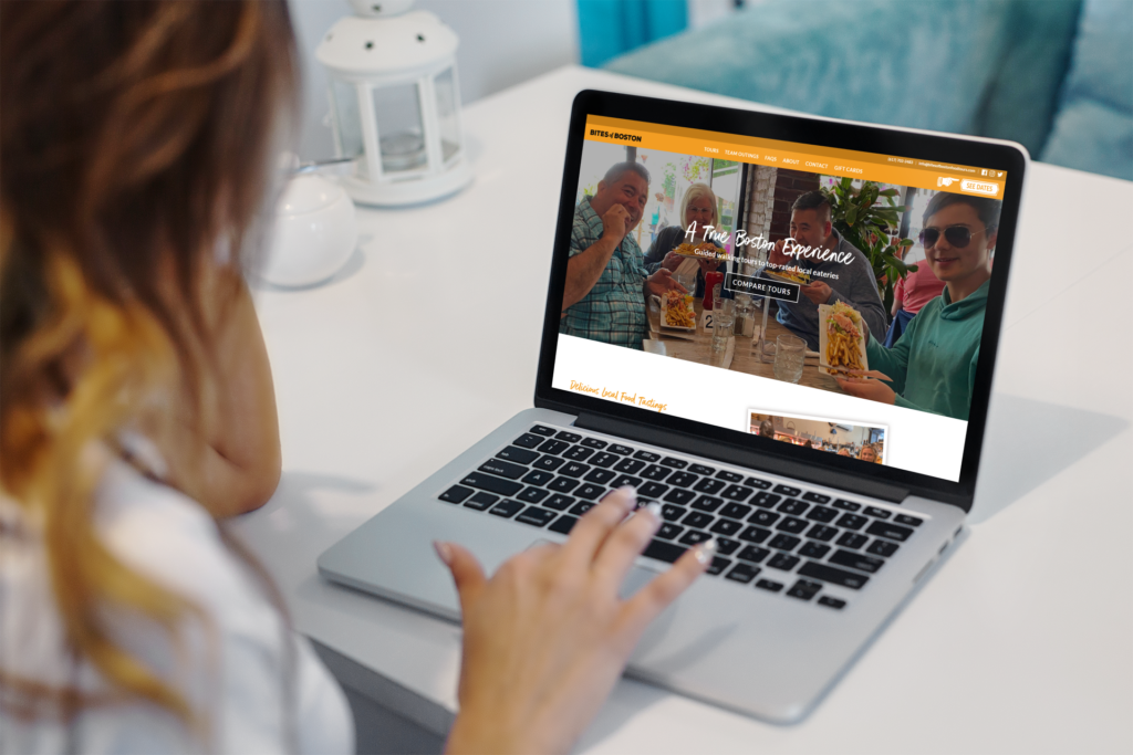 Tour operator reviewing booking analytics on laptop